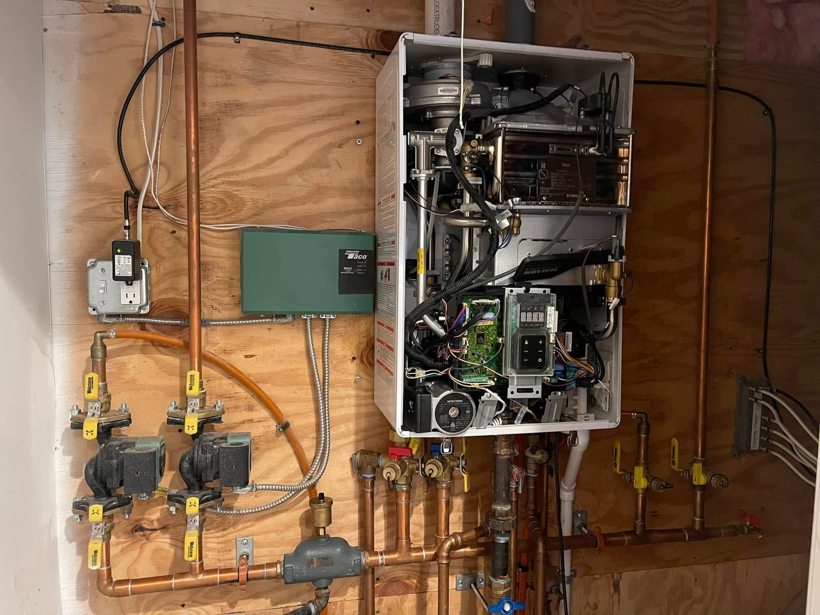 Technician performing a furnace tune-up before winter